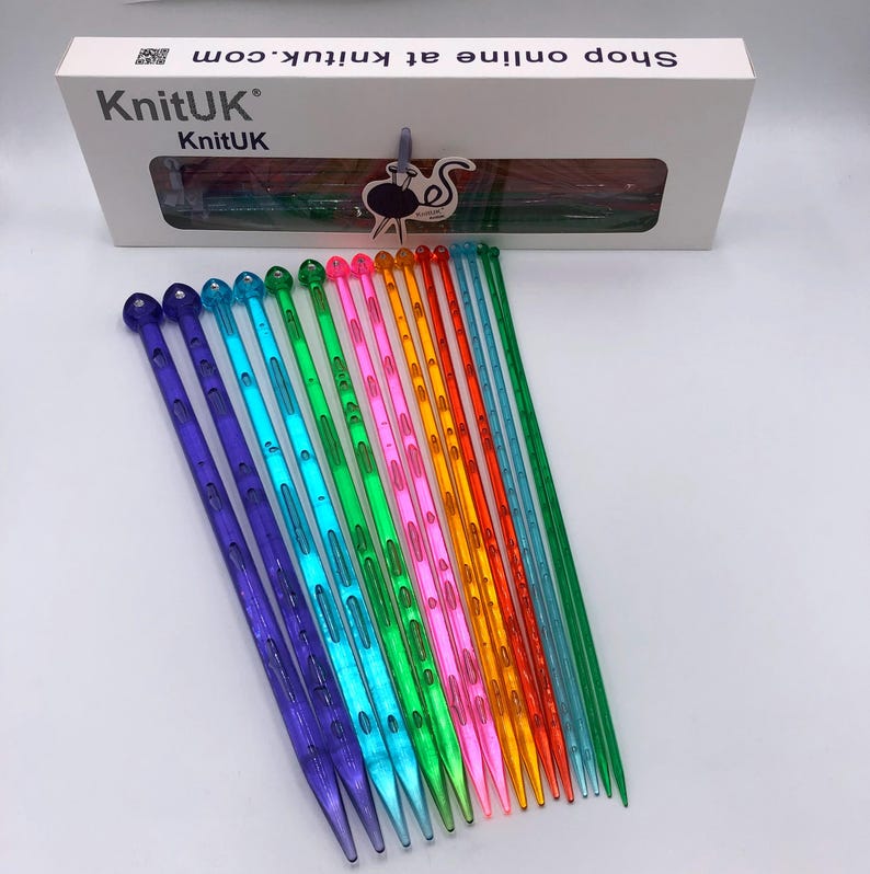 May include: A set of 16 colorful plastic knitting needles. The needles are arranged in a rainbow pattern and are all the same size. The needles are made of a clear plastic and have a smooth finish. The needles are perfect for beginners and experienced knitters alike.
