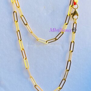 Puede incluir: Un collar de cadena de oro con cierre de mosquet&oacute;n. La cadena est&aacute; hecha de eslabones ovalados.