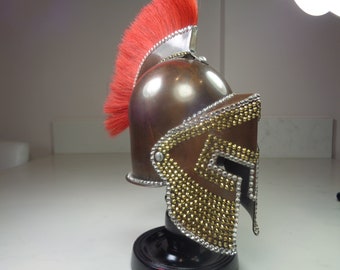 Miniature 300 copper helmet with red plume decorated with gold aurum and clear Preciosa crystals in silver and black..