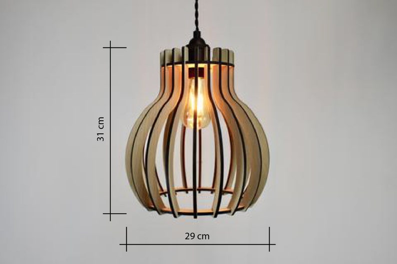 May include: A wooden pendant light with a natural wood finish and black metal accents. The light is 31 inches tall and 29 inches wide.