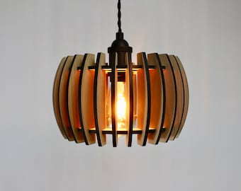 May include: A wooden pendant light fixture with a round, cage-like design. The light fixture is made of thin, wooden slats that are arranged in a circular pattern. The light fixture is lit with a warm, incandescent bulb.