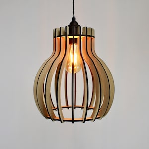 May include: A wooden pendant light fixture with a bulbous shape and a black metal frame. The light is on and the bulb is glowing.