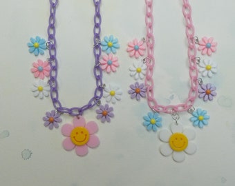 Happy smiley pastel flower charm necklaces.