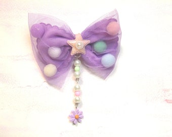 Lilac fairy kei hairbow with tule and ponpons.