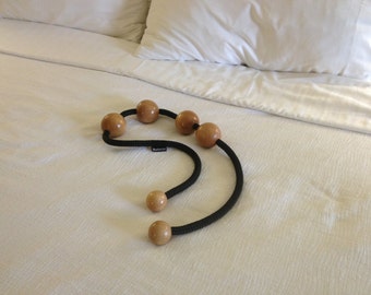 Ballatsu therapeutic massage product that uses ball pressure to manage acute and chronic pain.