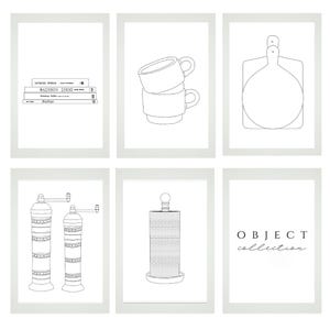 May include: Six framed black and white line drawings of kitchen and home decor items. The images include a stack of books, two stacked mugs, a cutting board, two pepper grinders, a paper towel holder, and the text "OBJECT collection."