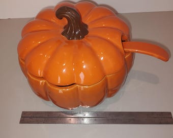 Pumpkin soup tureen with ladle