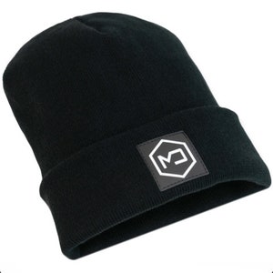 May include: Black beanie with a black leather patch featuring a white logo. The logo is a hexagon with the letter "M" inside.