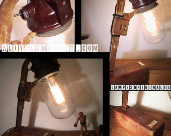 An old globe held by a wheel by lampesoriginales .com key adjustable wrench lamp