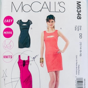 May include: McCall's M6348 sewing pattern featuring three dress designs. The pattern includes a red dress with a keyhole neckline, a black dress with lace sleeves, and a pink dress with a keyhole detail. The pattern size is DD (12-14-16-18).
