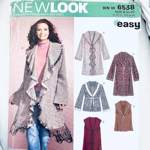 May include: A New Look sewing pattern featuring a woman wearing a fringed coat. The pattern includes multiple coat designs, with the text "NEW LOOK" and "easy" visible. Size A 10-22, FR. 38-50 EUR. 36-48.