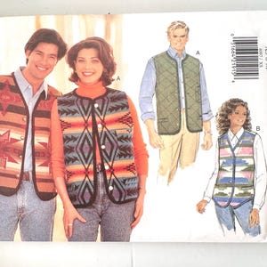 May include: A Butterick sewing pattern envelope for vests, labeled 4097, featuring illustrations of four different vest styles. The designs include geometric patterns in warm earth tones, a solid quilted green vest, and a multi-colored striped vest.