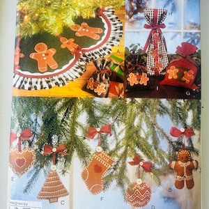 May include: Vogue Craft 9299 sewing pattern envelope featuring illustrations of Christmas decorations including a tree skirt, gift bags, and ornaments shaped like gingerbread people, hearts, stockings, and trees, designed by Linda Carr.