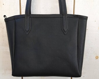 Beautiful,Large Black Zippered Tote Bag in Italian Saffiano  Leather. Extra Long Shoulder Straps and Lots of Pockets. Rifle Paper Co Lining.
