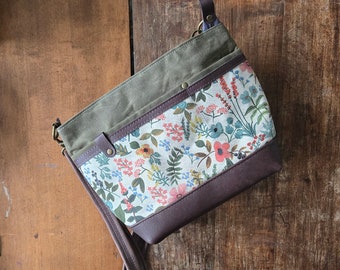 Handbag in Waxed Canvas and Floral Oilcloth with Leather Accents. Rifle Paper Co. Purse with Zipper Top Closure and Crossbody Strap.