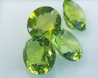 Peridot gemstone; Lot of #4 oval (9×11) cut stones; 14.50 cts in total