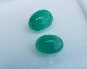 Zambian Emerald cabs; #2 oval Emerald cabochons (not a pair); minor oiled; 2.90 cts in total