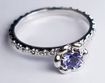 Tanzanite Ring; Natural Tanzanite 0.39 Cts, Round 4.5 mm; Stirling Silver decorative band; Size US 7