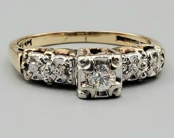 Estate diamond engagement ring by 'Matched Perfection'; 14k gold shank with platinum head; W 2.448g; Size US 5.5