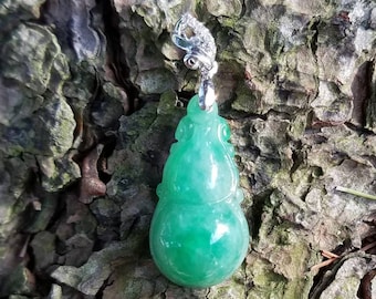 Certified Burmese Natural Jadeite; Green Jade Pendant; Untreated; 12.41 CTS; Hand carved in China; 18 kt white gold and diamond bail
