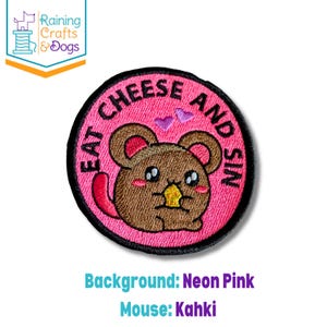 May include: A circular embroidered patch with a neon pink background and a black border. The patch features a brown mouse holding a yellow piece of cheese, with two small purple hearts above it and the text EAT CHEESE AND SIN in black.