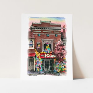 May include: A hand-drawn illustration of a building with a red sign that says "The Palace" in white letters. The building has a brick facade and a colorful mural on the front. The illustration is done in a cartoon style and has a whimsical feel.