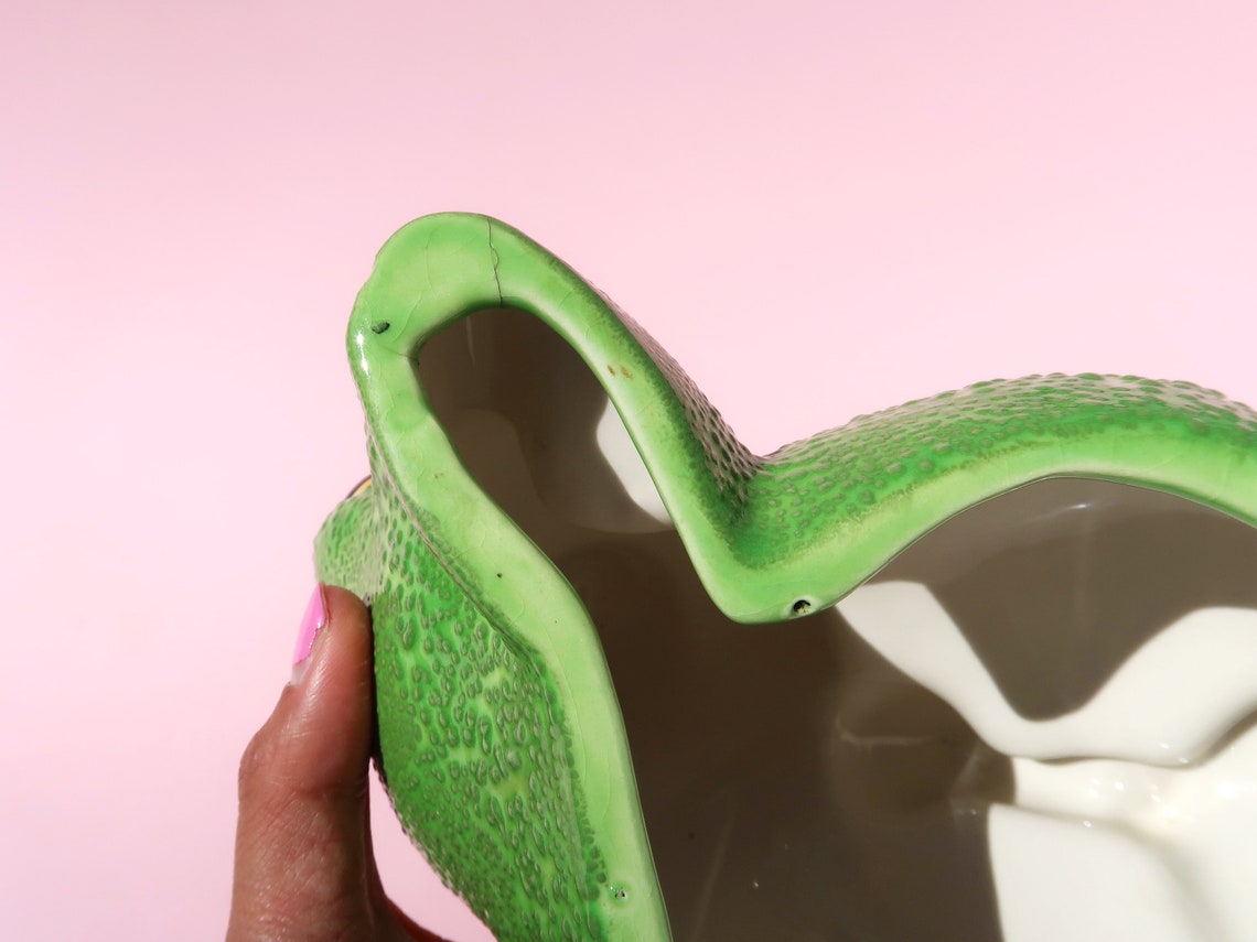 lounging frog statue