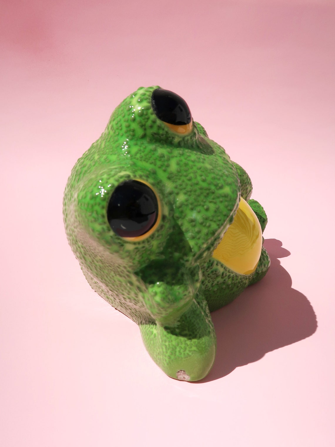 lounging frog statue