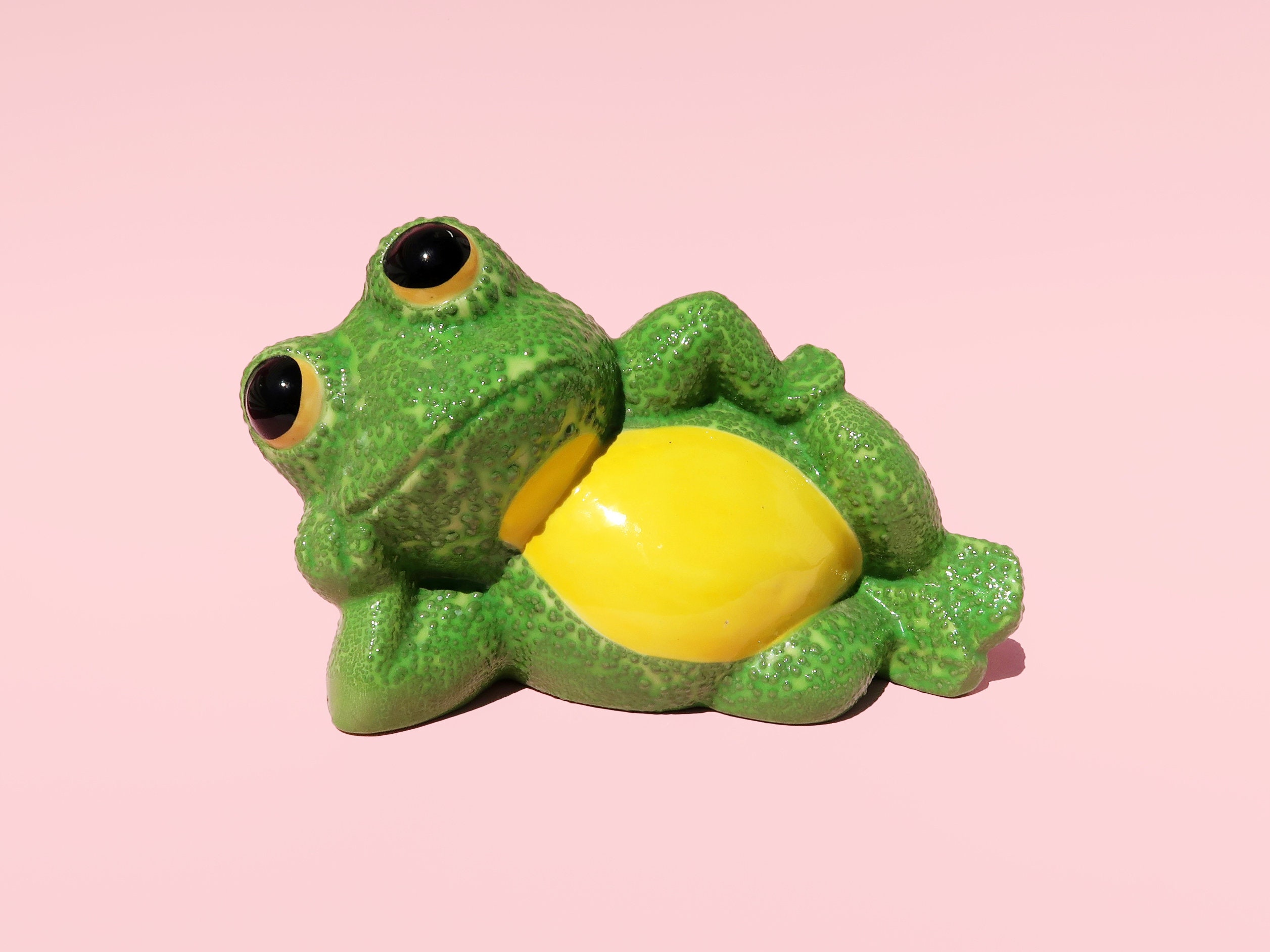 lounging frog statue