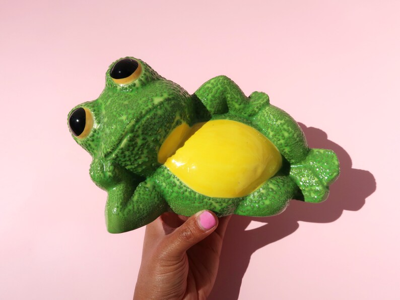 lounging frog statue