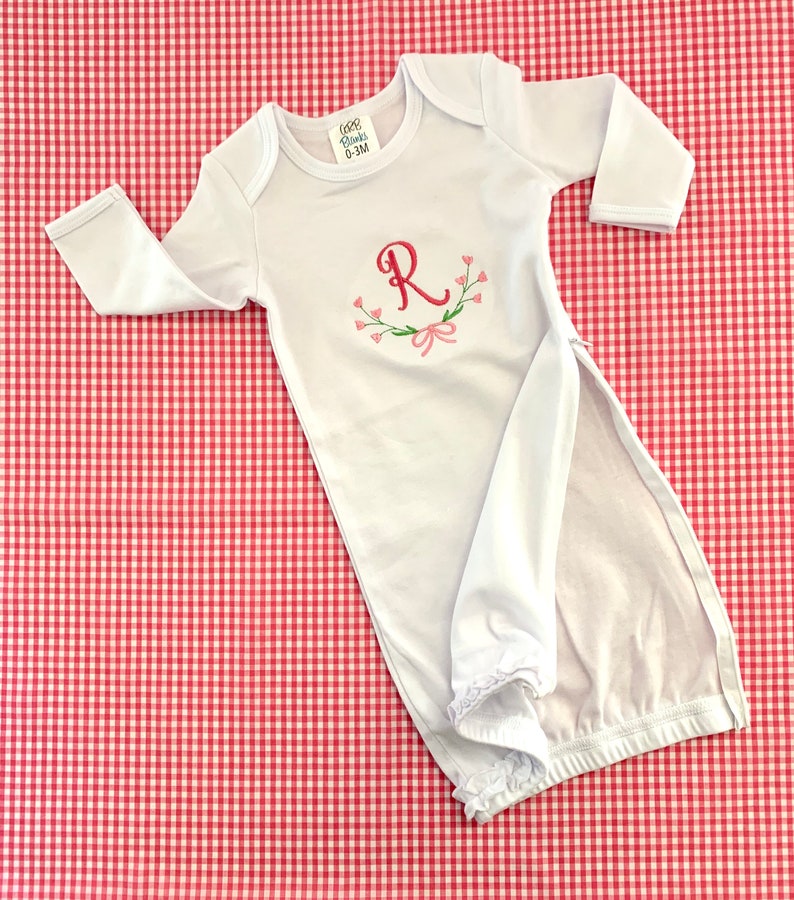 Perfect for a coming home outfit! Girls Ruffle Monogrammed Gown with floral design