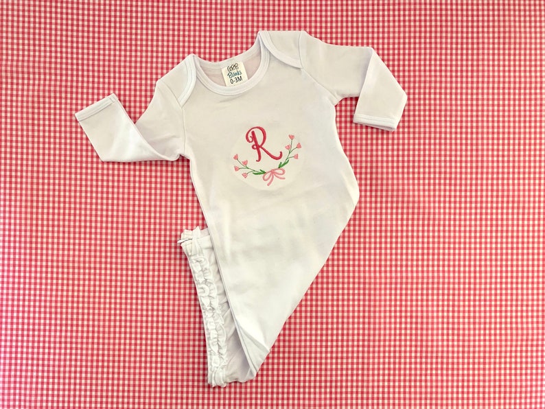 Perfect for a coming home outfit! Girls Ruffle Monogrammed Gown with floral design