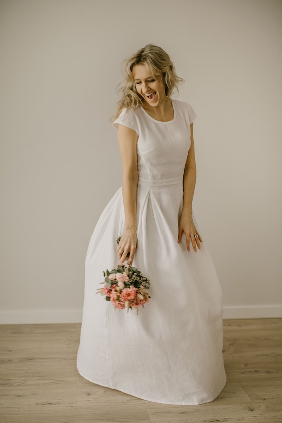 a line minimalist dress Minimalist Satin A Line Short Sleeve Wedding Dress with Belt