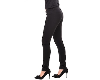 May include: Black skinny jeans with a slim fit and a high waist.