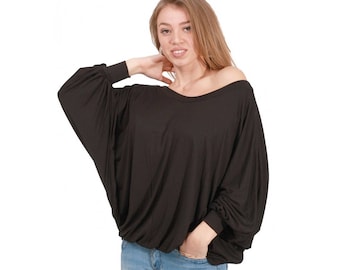 May include: A black, long-sleeved, loose-fitting shirt with a boat neck.