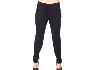 May include: Black pants with a wide leg and a slightly gathered waist.