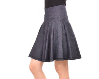 May include: A dark blue denim skirt with a flared silhouette. The skirt has a high waist and a slightly gathered design.