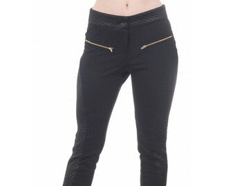 May include: Black pants with a quilted pattern and gold zipper accents.