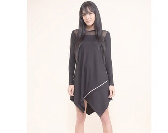 May include: A black long-sleeved dress with a mesh panel at the neckline and a diagonal white zipper detail. The dress has a slightly asymmetrical hemline.