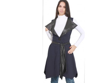 May include: A long navy blue waistcoat with a black leather collar and belt. The waistcoat has a single button fastening and a slightly flared hem.