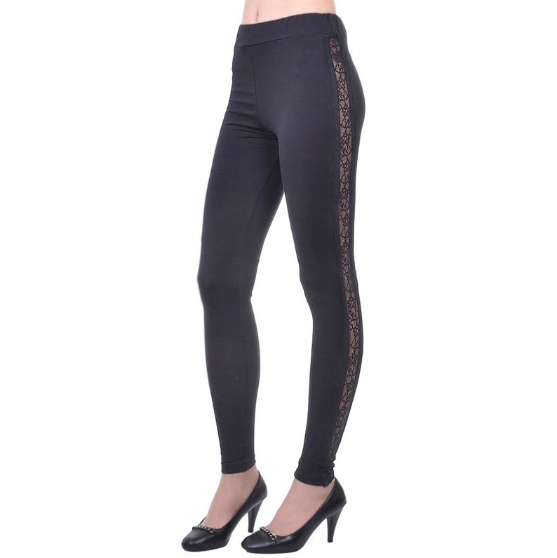 May include: Black leggings with a lace panel down the side.
