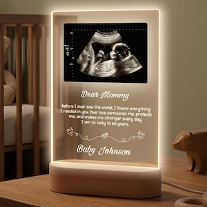 May include: A set of three ceramic mugs with a speckled, matte finish. The mugs are in shades of cream, light gray, and dark gray. Each mug has a simple, minimalist design and a rounded handle.