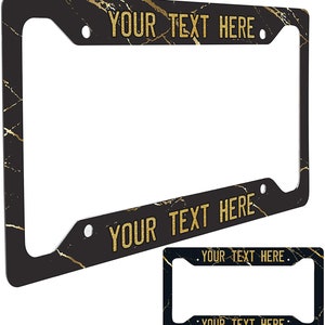Puede incluir: Marco de matr&iacute;cula de coche de m&aacute;rmol negro y dorado con el texto "YOUR TEXT HERE" en la parte superior e inferior.