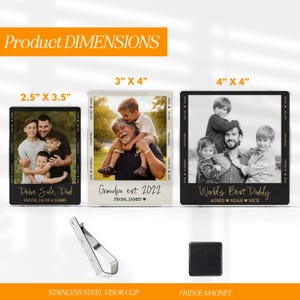 May include: Three photo frames with family photos, including a 2.5" x 3.5" frame, a 3" x 4" frame, and a 4" x 4" frame. The frames have black borders and text that reads "Drive Safe, Dad", "Grandpa est. 2022", and "World's Best Daddy". Also included is a stainless steel visor clip and a fridge magnet.