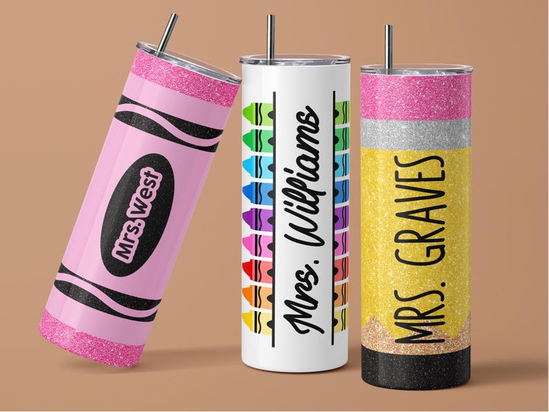 May include: Three personalized tumblers with straws. One is pink and shaped like a crayon with "Mrs. West" on it. The second is white with colorful crayon designs and "Mrs. Williams". The third is yellow, silver, and black, shaped like a pencil, with "Mrs. Graves".
