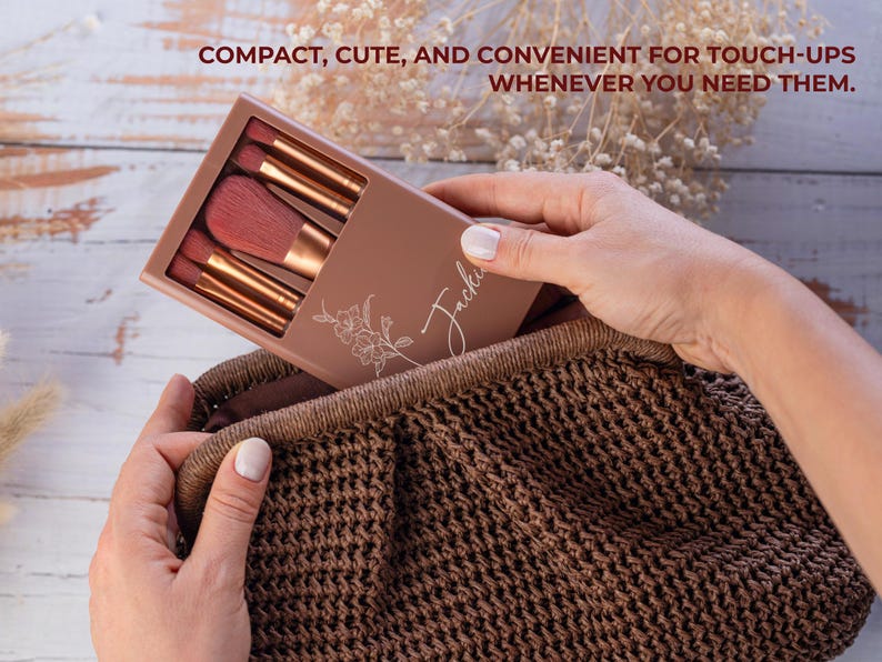 May include: A makeup brush set in a brown case with the name "Jackie" and a floral design. The case is held in a brown woven bag. The text "COMPACT, CUTE, AND CONVENIENT FOR TOUCH-UPS WHENEVER YOU NEED THEM." is at the top.