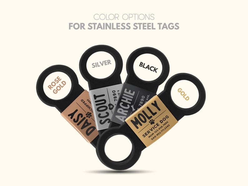 May include: Five stainless steel dog tags with different colored rings. The tags are labeled with the names "Daisy", "Scout", "Archie", "Molly", and "Gold".