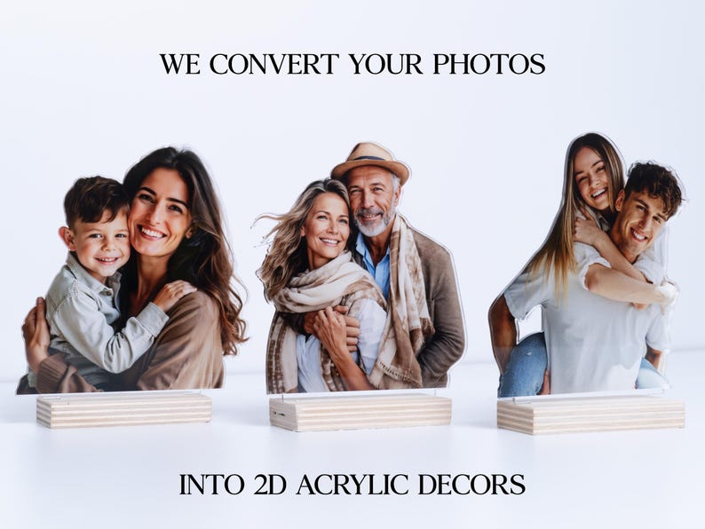 May include: Acrylic photo decor featuring three family portraits. The text reads "WE CONVERT YOUR PHOTOS INTO 2D ACRYLIC DECORS." Each portrait is mounted on a wooden base, showcasing a family of three, a couple, and a couple with a piggyback ride.