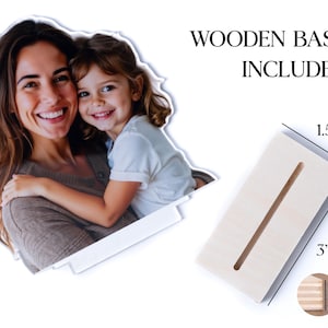 May include: A photo of a woman and a child, with a wooden base included. The base is 3 inches long, 1.5 inches wide, and 0.6 inches thick. The text "WOODEN BASE INCLUDED" is displayed above the base.