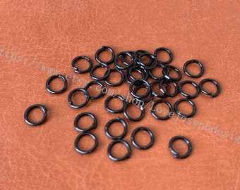 venta al por mayor 500 piezas / lote negro Chapado 0.7mmx5mm anillos de salto abiertos